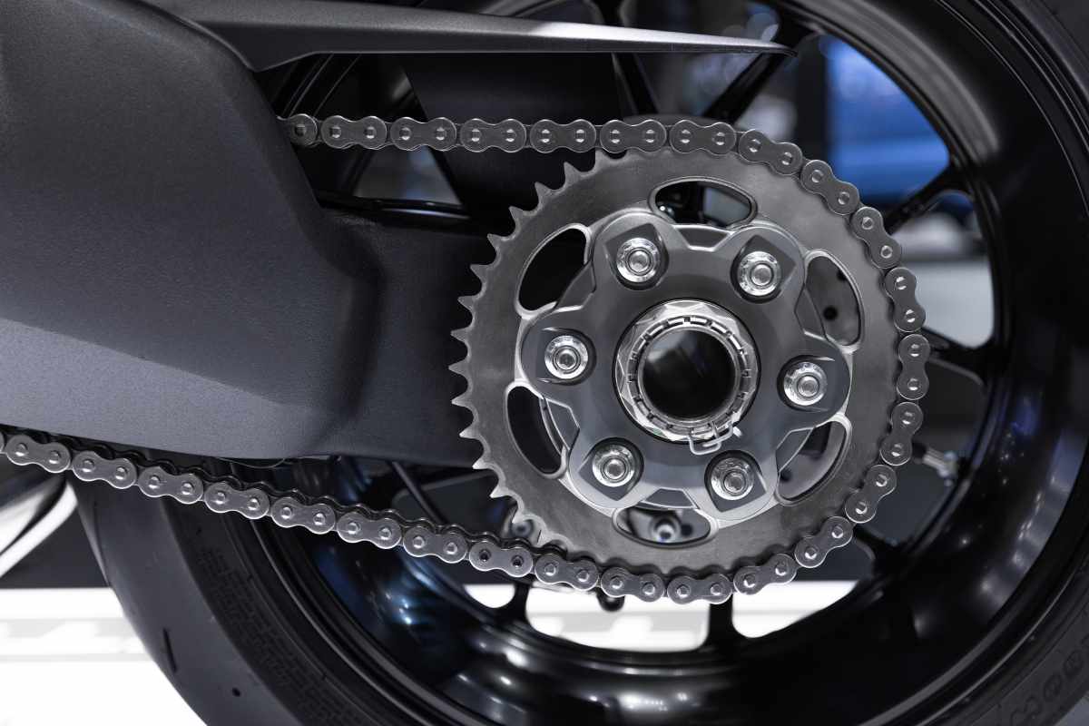 A close up of a motorcycle chain.